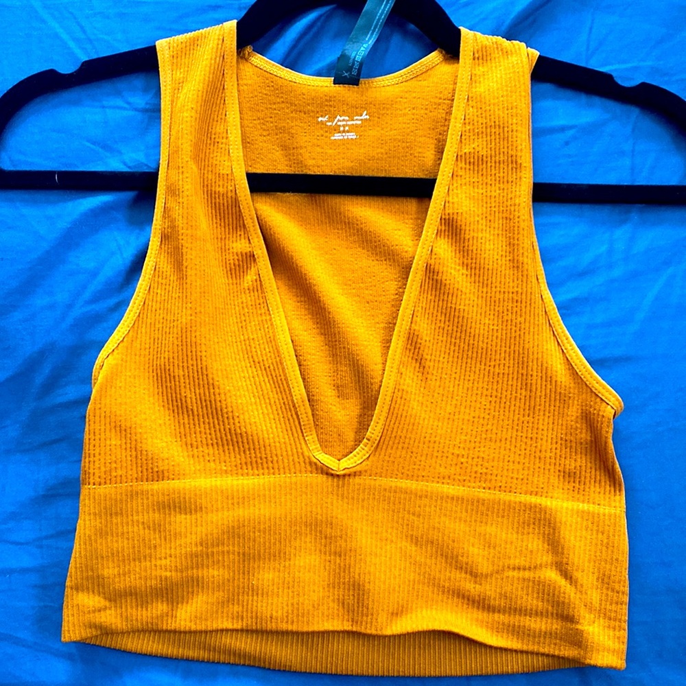 Out from under for urban outfitters. Mustard crop top, low plunge